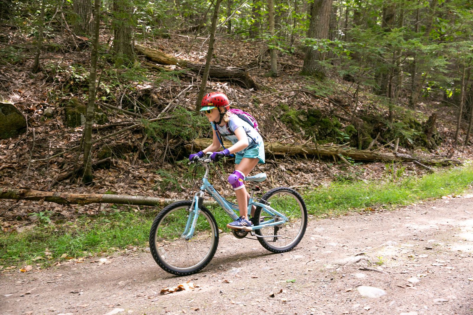 Young rider on a forest trail